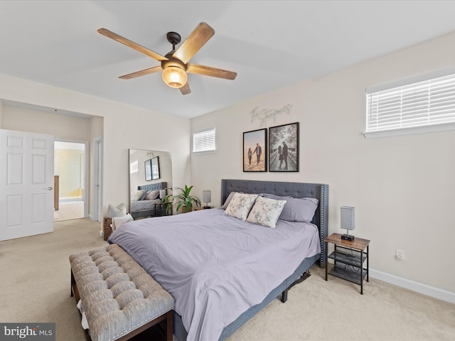 bedroom with ceiling fan and light colored carpet