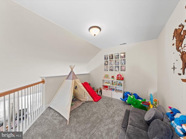 playroom with carpet flooring and lofted ceiling