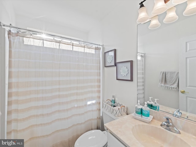 bathroom with a shower with curtain, vanity, and toilet