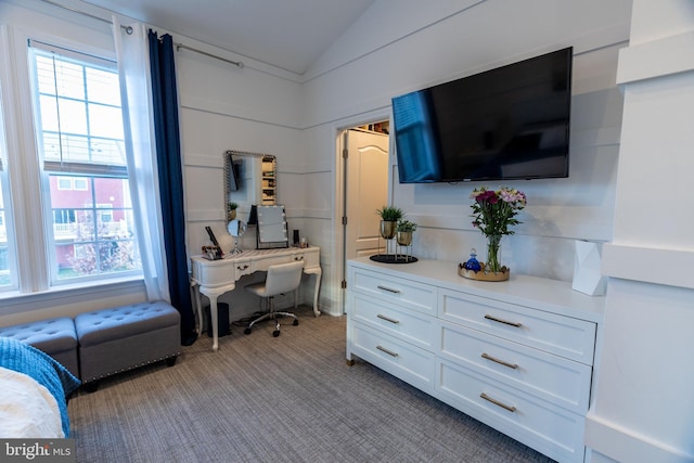 carpeted bedroom featuring lofted ceiling