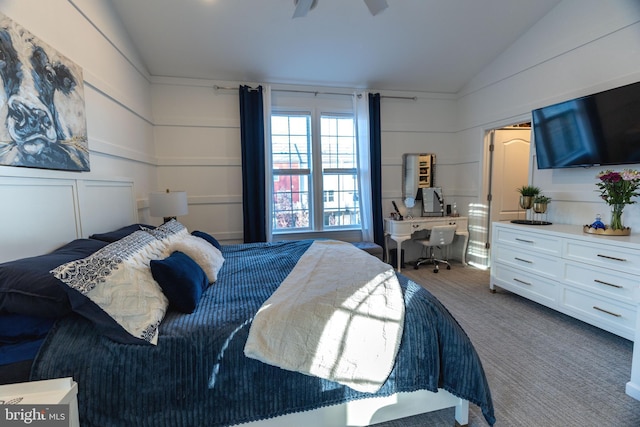 carpeted bedroom with ceiling fan and lofted ceiling