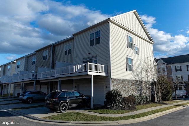 exterior space with central AC and a garage