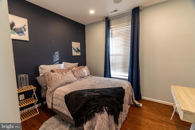 bedroom featuring dark wood-type flooring