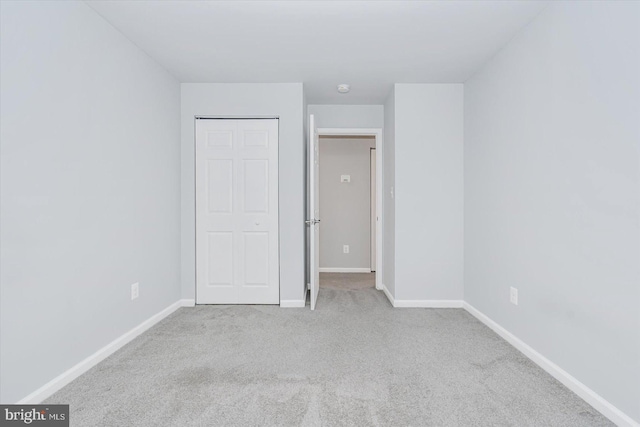 unfurnished bedroom with light carpet