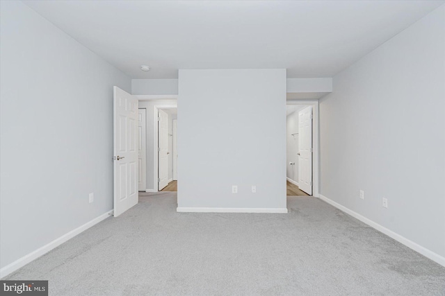 unfurnished bedroom featuring light colored carpet