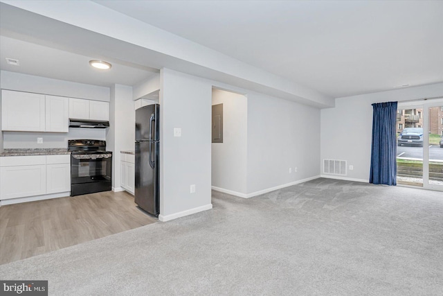 kitchen with black appliances, white cabinetry, light carpet, and electric panel