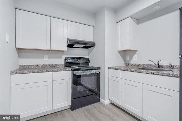 kitchen with white cabinets, light hardwood / wood-style floors, sink, and black electric range