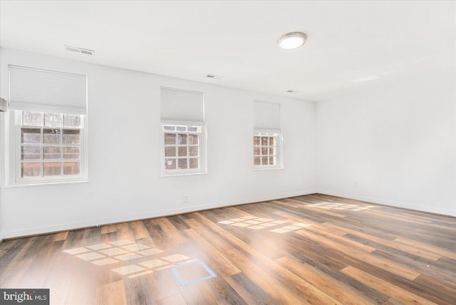 empty room featuring wood-type flooring