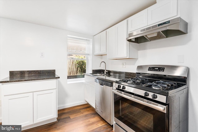 kitchen featuring white cabinetry, sink, dark hardwood / wood-style flooring, ventilation hood, and appliances with stainless steel finishes