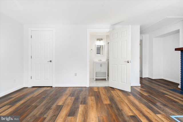 unfurnished room with dark hardwood / wood-style floors