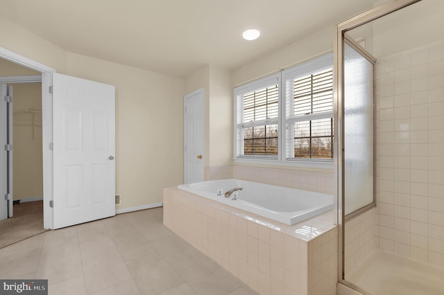 bathroom with tile patterned flooring and plus walk in shower