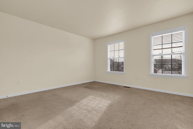 spare room featuring carpet flooring