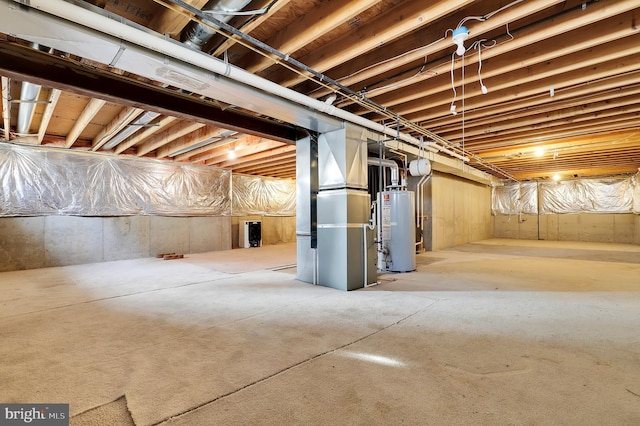 basement featuring gas water heater and heating unit