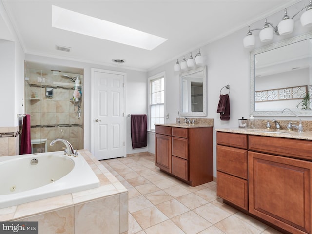 bathroom with vanity, tile patterned floors, a skylight, ornamental molding, and independent shower and bath