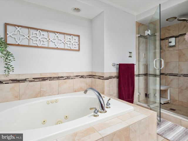 bathroom featuring separate shower and tub and crown molding