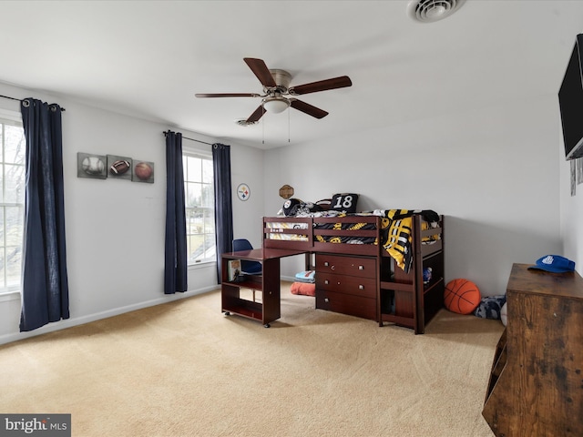 carpeted bedroom featuring ceiling fan