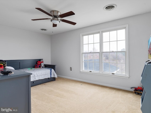 carpeted bedroom featuring ceiling fan