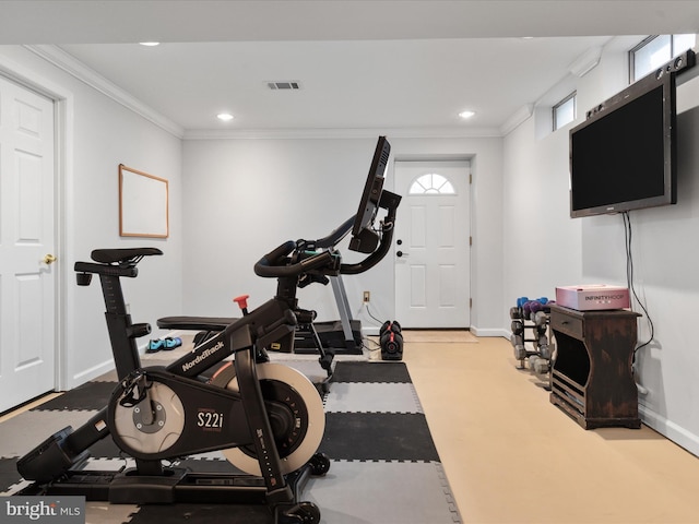 workout area featuring ornamental molding