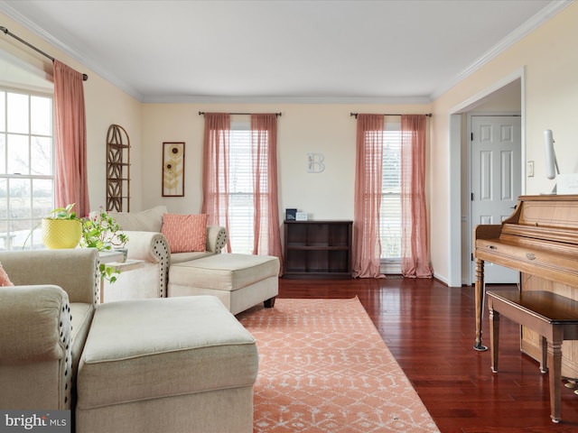 living room with dark hardwood / wood-style flooring, plenty of natural light, and crown molding