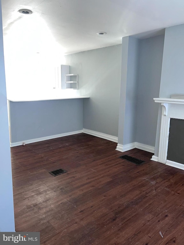 interior space with dark hardwood / wood-style flooring