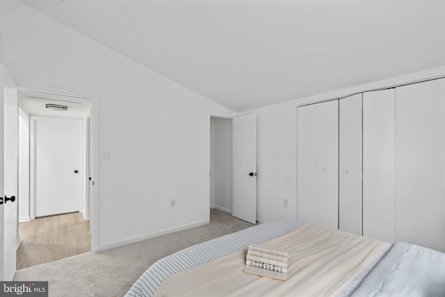 6136 Sinbad Pl, Columbia, MD 21045 - bedroom with lofted ceiling, light colored carpet, and a closet