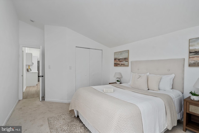 6136 Sinbad Pl, Columbia, MD 21045 - bedroom with vaulted ceiling, light carpet, and a closet