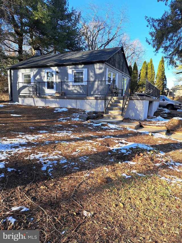 view of front of house with a wooden deck