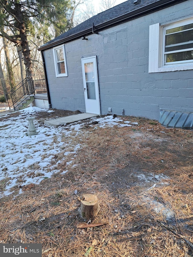 view of snow covered house