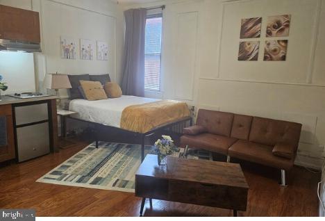 bedroom featuring dark wood-type flooring