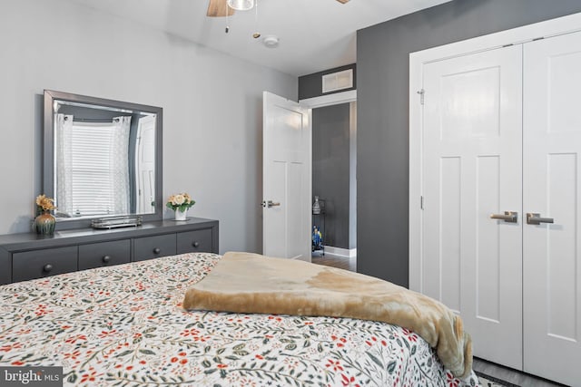 bedroom with ceiling fan and a closet