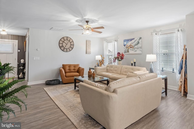 living room with hardwood / wood-style flooring and ceiling fan