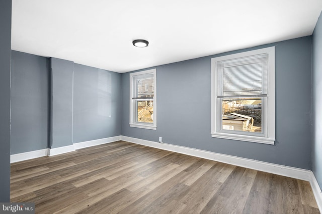 spare room featuring hardwood / wood-style floors