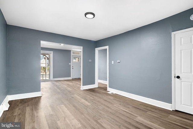 spare room with light hardwood / wood-style flooring