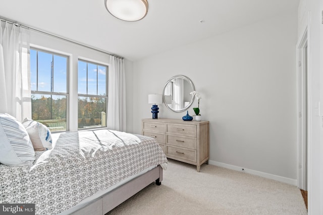 bedroom with light colored carpet