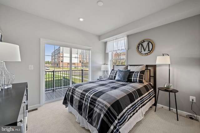 carpeted bedroom featuring access to exterior