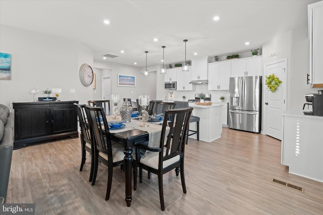 dining area featuring light hardwood / wood-style flooring