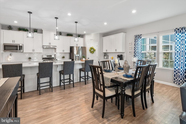 dining area featuring light hardwood / wood-style flooring