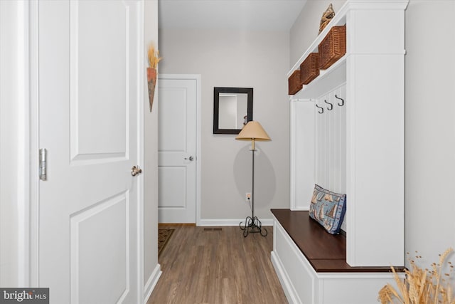 mudroom with light hardwood / wood-style flooring