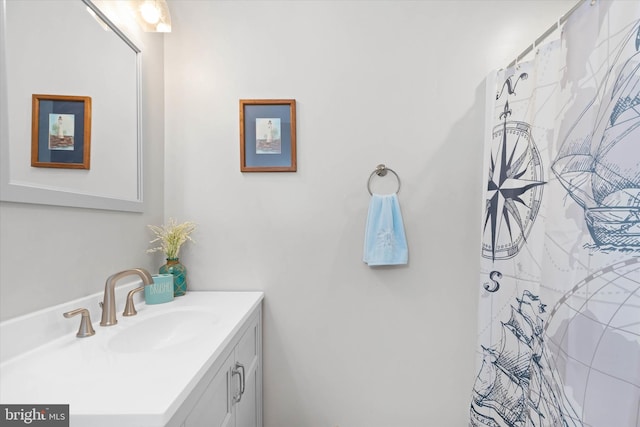 bathroom with vanity and a shower with shower curtain