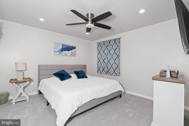 carpeted bedroom featuring ceiling fan