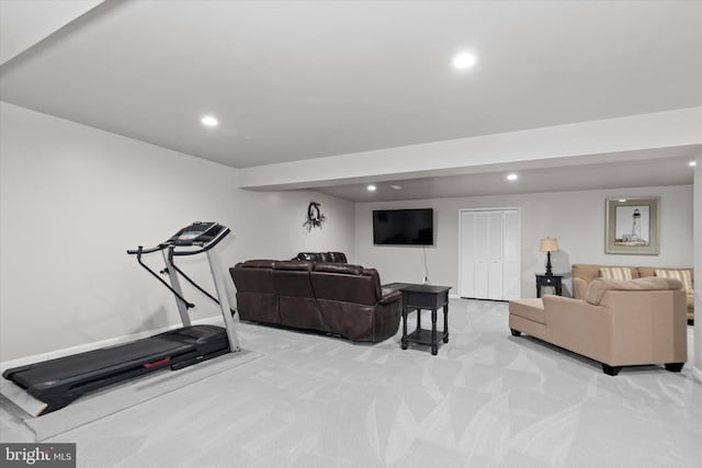 exercise room with light colored carpet