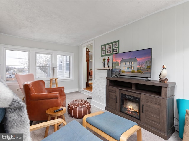 carpeted living room with crown molding, a fireplace, and a textured ceiling