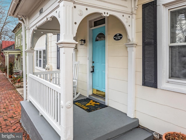 doorway to property with a porch