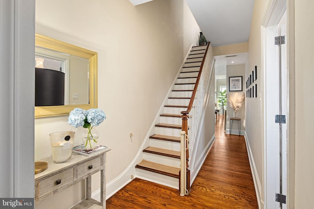 stairs with hardwood / wood-style flooring