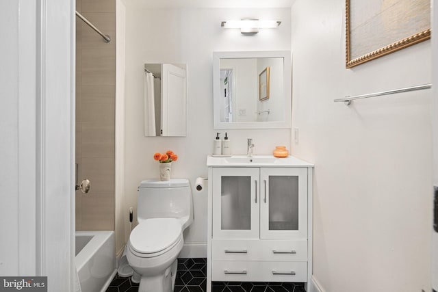 full bathroom with tile patterned flooring, vanity, toilet, and tiled shower / bath combo