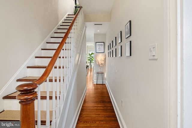 stairs with hardwood / wood-style floors