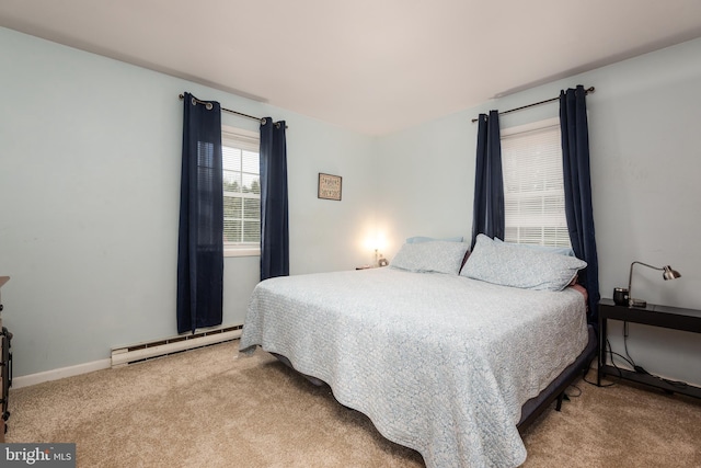 carpeted bedroom with baseboard heating