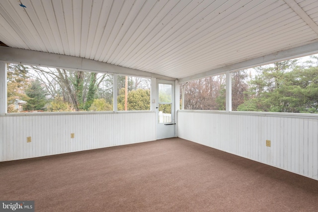 unfurnished sunroom with lofted ceiling