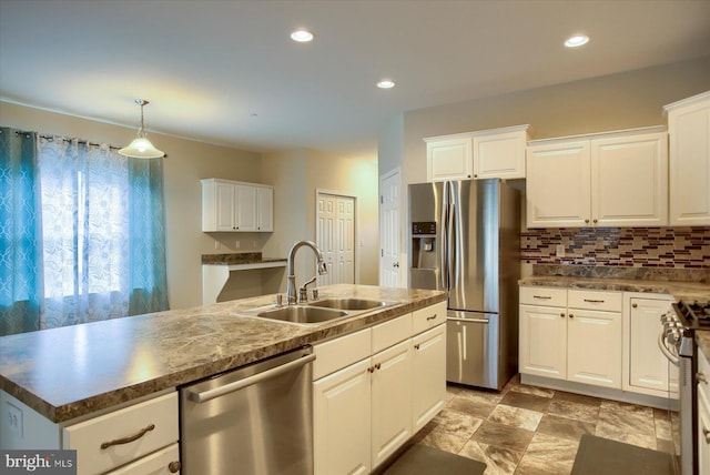 kitchen featuring white cabinets, stainless steel appliances, and sink