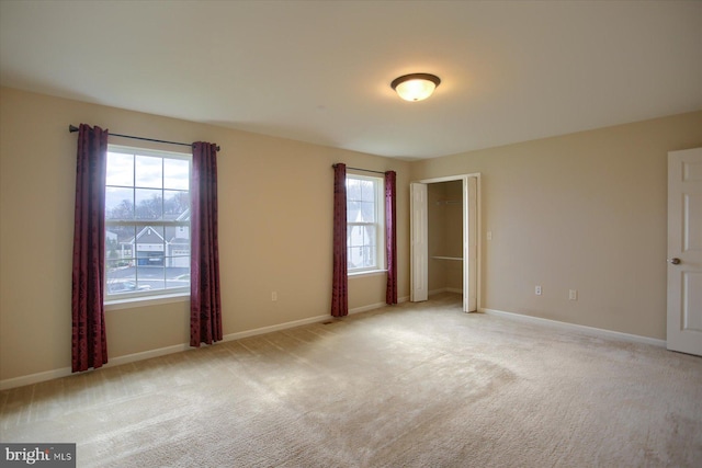 spare room with light colored carpet